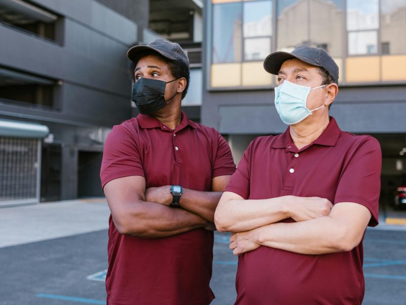 Men in Maroon Shirts Wearing Face Masks